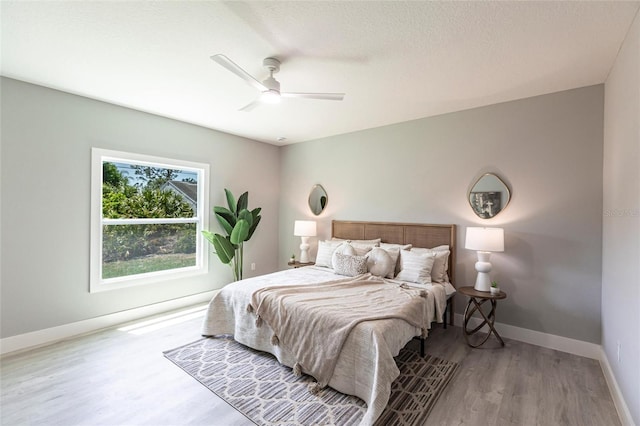 19160 Ruskin Ave, Port Charlotte, FL 33954 - bedroom featuring wood finished floors, baseboards, and ceiling fan