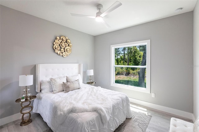 19160 Ruskin Ave, Port Charlotte, FL 33954 - bedroom with wood finished floors, baseboards, and ceiling fan