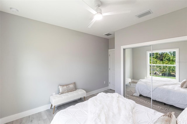 19160 Ruskin Ave, Port Charlotte, FL 33954 - bedroom with a closet, baseboards, wood finished floors, and ceiling fan