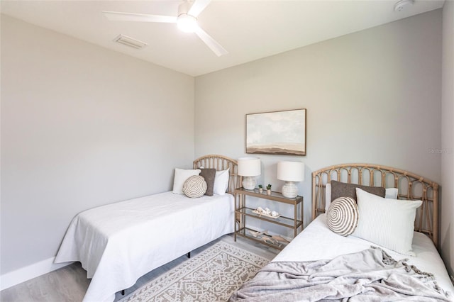 19160 Ruskin Ave, Port Charlotte, FL 33954 - bedroom featuring wood finished floors, ceiling fan, and baseboards