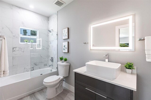 19160 Ruskin Ave, Port Charlotte, FL 33954 - full bath featuring toilet, vanity, shower / bath combination, and healthy amount of natural light