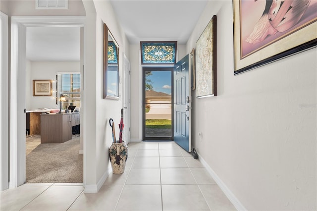 25312 E Lenox Cir, Punta Gorda, FL 33950 - entryway featuring light tile patterned floors and baseboards