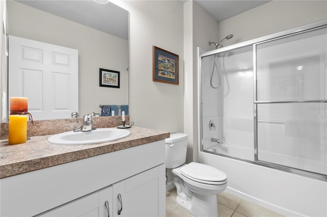 25312 E Lenox Cir, Punta Gorda, FL 33950 - full bathroom featuring toilet, tile patterned floors, vanity, and bath / shower combo with glass door