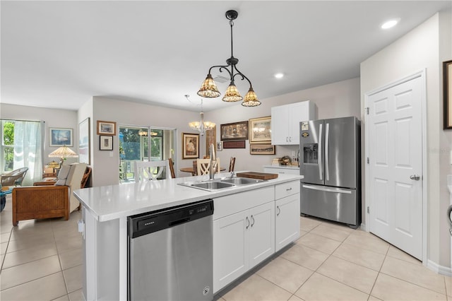 25312 E Lenox Cir, Punta Gorda, FL 33950 - kitchen featuring stainless steel appliances, a sink, light tile patterned floors, healthy amount of natural light, and recessed lighting