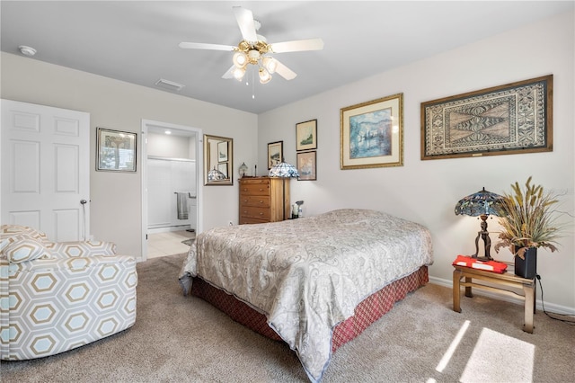 25312 E Lenox Cir, Punta Gorda, FL 33950 - bedroom with light carpet, connected bathroom, ceiling fan, and baseboards