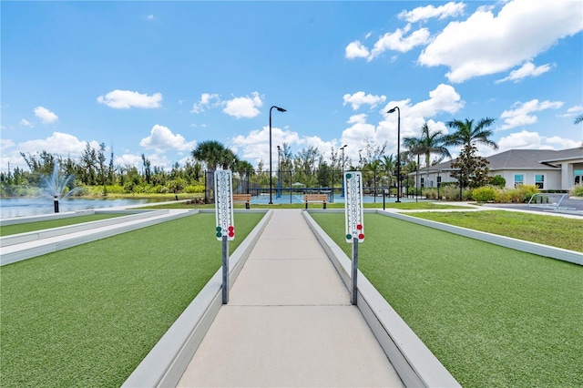 25312 E Lenox Cir, Punta Gorda, FL 33950 - view of community with a bocce ball area and a water view