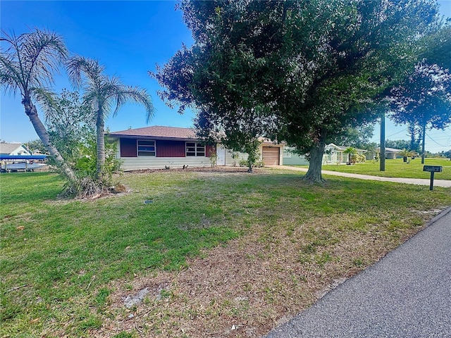 27193AND27197 Voyageur Dr, Punta Gorda, FL 33983 - view of front facade featuring a front lawn