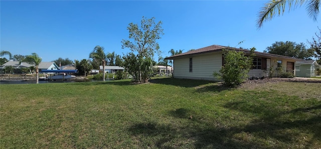 27193AND27197 Voyageur Dr, Punta Gorda, FL 33983 - view of grassy yard featuring a water view