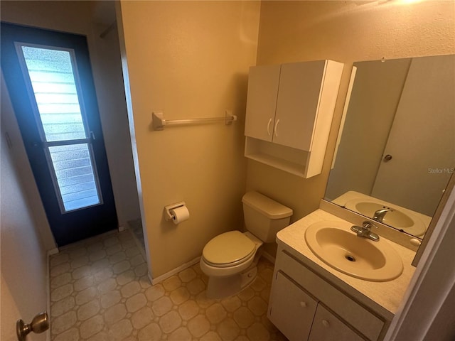 27193AND27197 Voyageur Dr, Punta Gorda, FL 33983 - bathroom with tile patterned floors, vanity, toilet, and baseboards