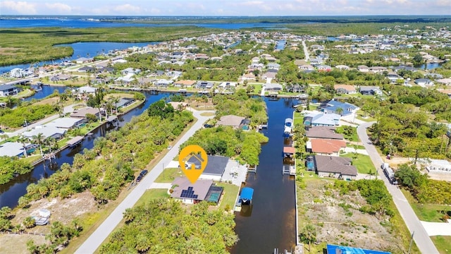 aerial perspective of suburban area with a large body of water