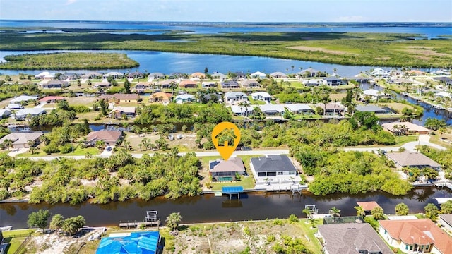 aerial view of residential area with a large body of water