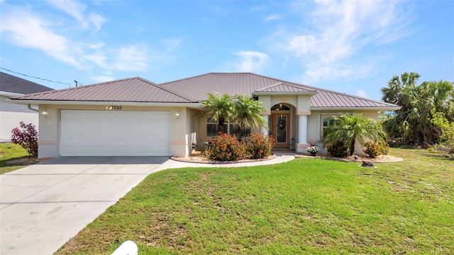 single story home with metal roof, stucco siding, an attached garage, and a standing seam roof