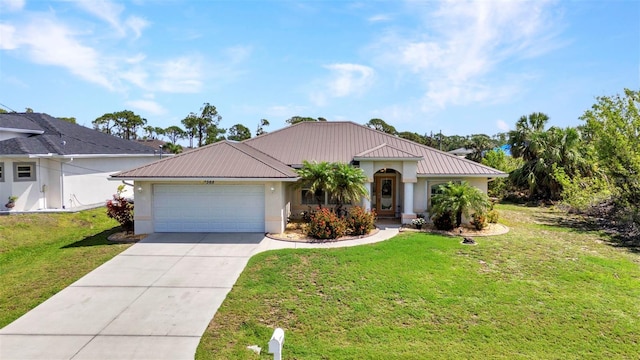 view of front of house featuring metal roof, a garage, stucco siding, and concrete driveway