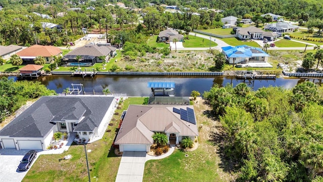aerial perspective of suburban area featuring a nearby body of water