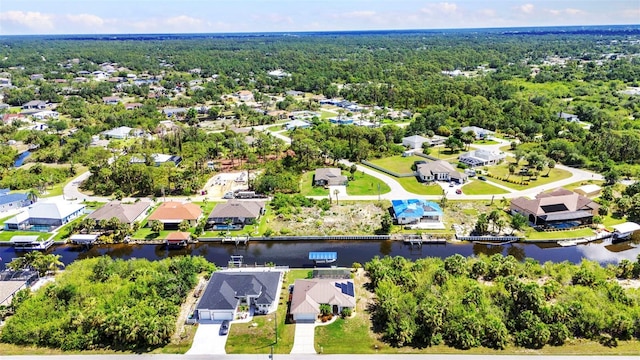 aerial view of residential area with a nearby body of water