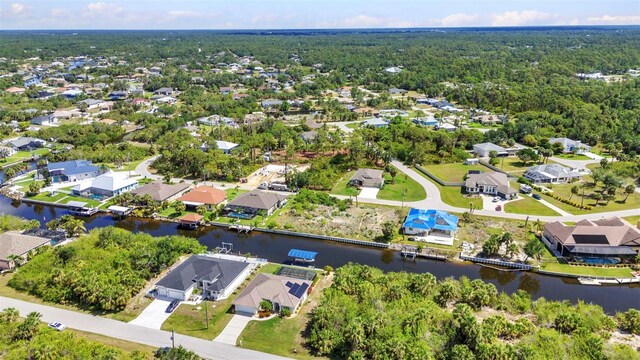 aerial perspective of suburban area with a large body of water