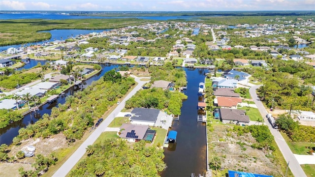 aerial perspective of suburban area featuring a large body of water