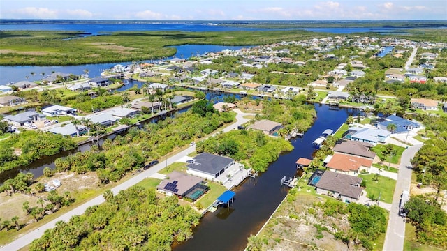 aerial perspective of suburban area featuring a large body of water