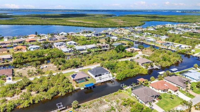 aerial perspective of suburban area with a large body of water