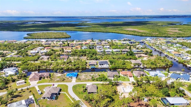 aerial view of residential area with a large body of water