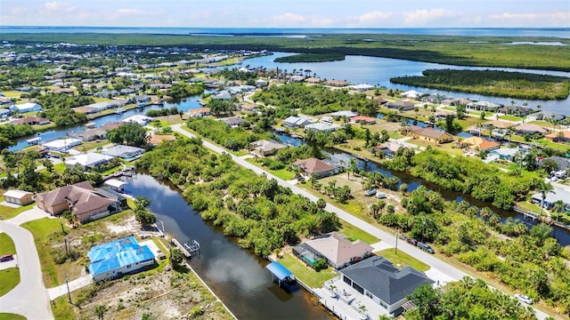 aerial perspective of suburban area with a large body of water