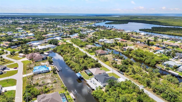aerial perspective of suburban area featuring a large body of water
