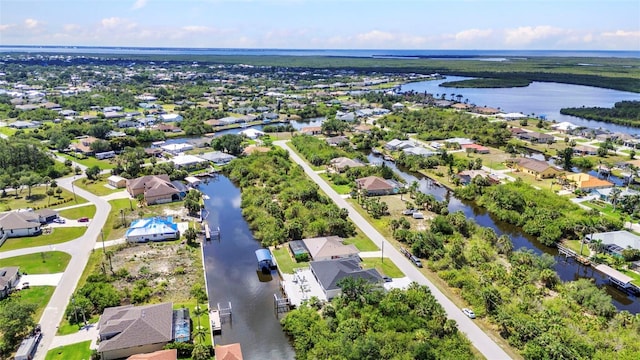 aerial perspective of suburban area featuring a large body of water