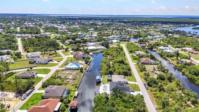 aerial perspective of suburban area with a nearby body of water