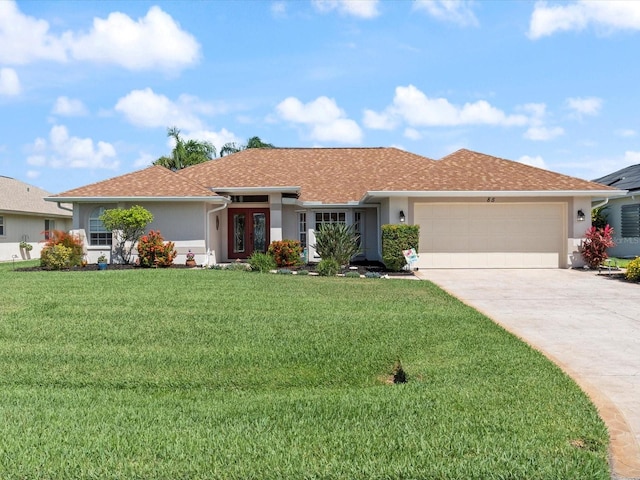 85 Long Meadow Ct, Rotonda West, FL 33947 - ranch-style house featuring a garage, stucco siding, a front lawn, and driveway