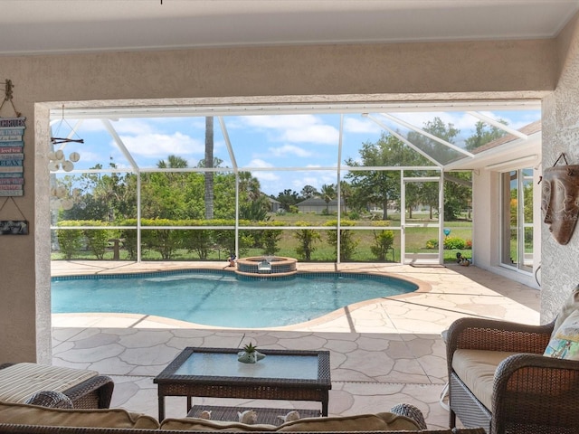 85 Long Meadow Ct, Rotonda West, FL 33947 - view of swimming pool featuring a patio area, glass enclosure, and a pool with connected hot tub