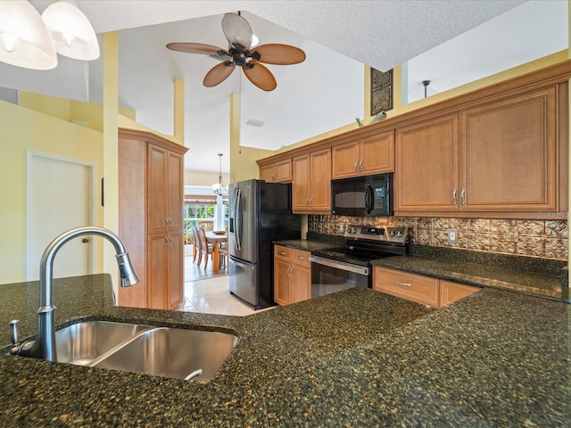 85 Long Meadow Ct, Rotonda West, FL 33947 - kitchen featuring stainless steel appliances, a sink, brown cabinetry, ceiling fan, and backsplash