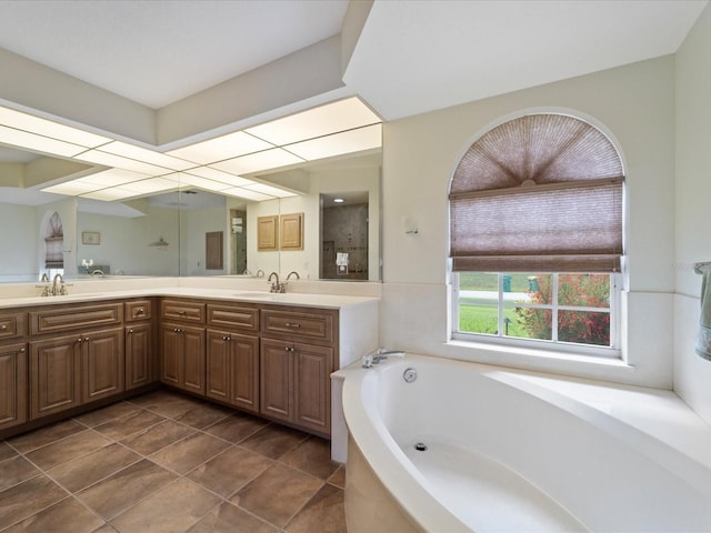 85 Long Meadow Ct, Rotonda West, FL 33947 - bathroom featuring a garden tub, double vanity, and tile patterned floors