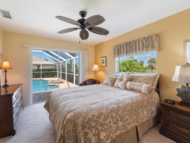 85 Long Meadow Ct, Rotonda West, FL 33947 - bedroom featuring a sunroom, access to exterior, carpet floors, and multiple windows