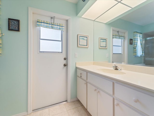 85 Long Meadow Ct, Rotonda West, FL 33947 - full bath with vanity, tile patterned flooring, baseboards, and a shower with shower door