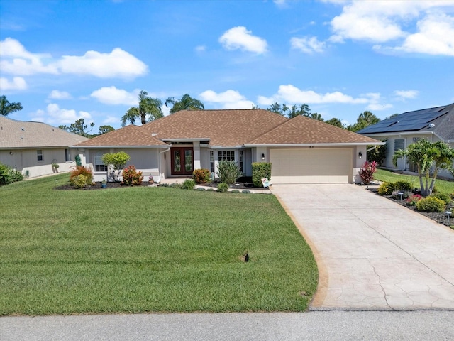 85 Long Meadow Ct, Rotonda West, FL 33947 - ranch-style house featuring an attached garage, french doors, a front yard, concrete driveway, and stucco siding