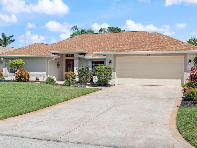 85 Long Meadow Ct, Rotonda West, FL 33947 - ranch-style home featuring stucco siding, concrete driveway, an attached garage, and a front yard