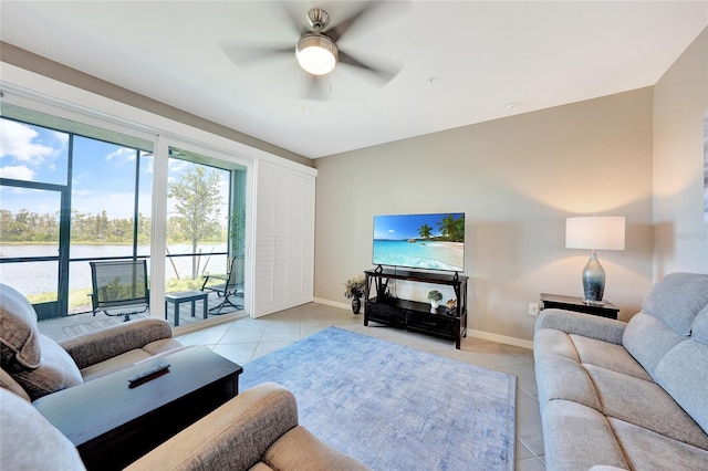 14271 Heritage Landing Blvd Unit 1516, Punta Gorda, FL 33955 - living room with light tile patterned flooring, ceiling fan, and baseboards