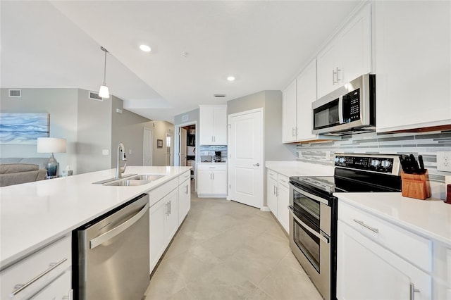14271 Heritage Landing Blvd Unit 1516, Punta Gorda, FL 33955 - kitchen featuring appliances with stainless steel finishes, a sink, tasteful backsplash, light countertops, and recessed lighting