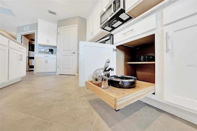 14271 Heritage Landing Blvd Unit 1516, Punta Gorda, FL 33955 - kitchen with white cabinets