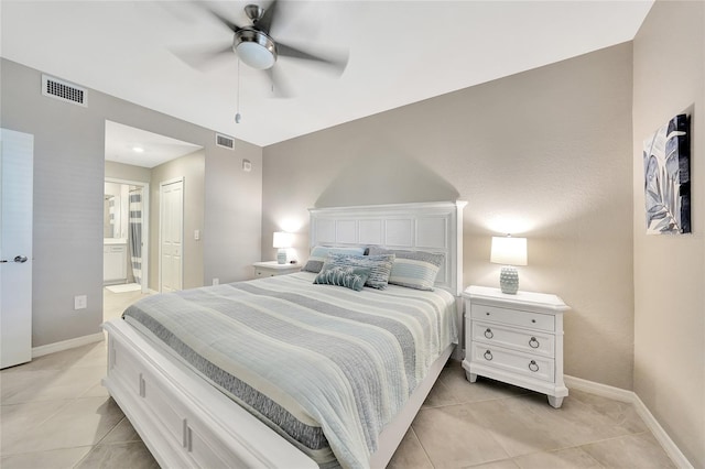 14271 Heritage Landing Blvd Unit 1516, Punta Gorda, FL 33955 - bedroom with light tile patterned floors, baseboards, ensuite bathroom, and a ceiling fan