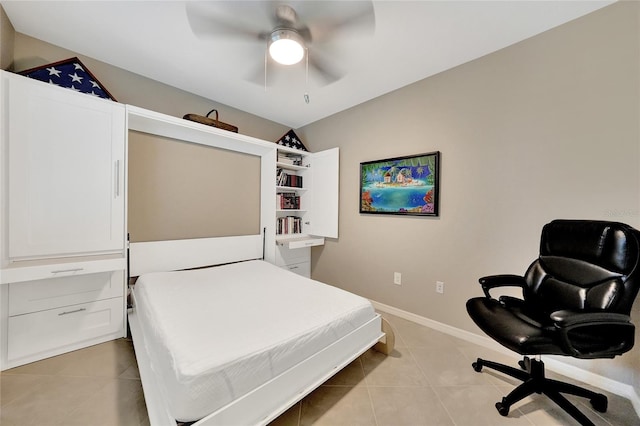 14271 Heritage Landing Blvd Unit 1516, Punta Gorda, FL 33955 - bedroom with light tile patterned flooring, ceiling fan, and baseboards