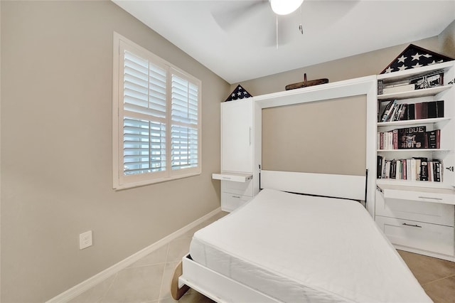 14271 Heritage Landing Blvd Unit 1516, Punta Gorda, FL 33955 - bedroom featuring light tile patterned floors, ceiling fan, and baseboards