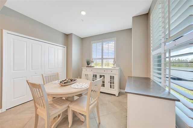 14271 Heritage Landing Blvd Unit 1516, Punta Gorda, FL 33955 - dining room featuring light tile patterned floors and baseboards