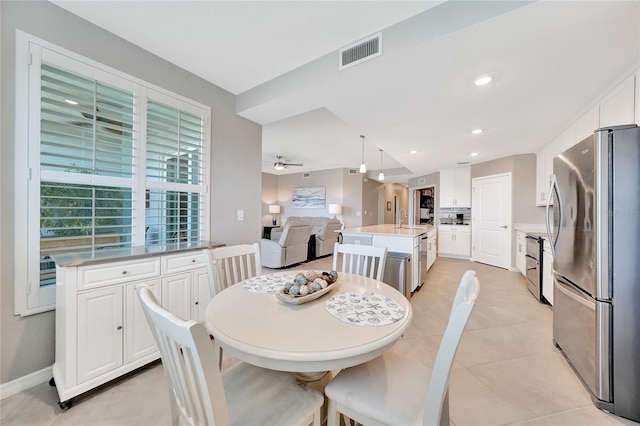 14271 Heritage Landing Blvd Unit 1516, Punta Gorda, FL 33955 - dining space with light tile patterned flooring, ceiling fan, and baseboards
