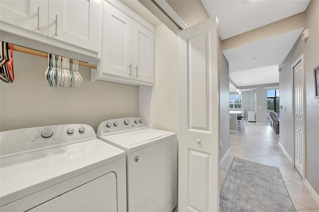 14271 Heritage Landing Blvd Unit 1516, Punta Gorda, FL 33955 - washroom with washing machine and dryer, light tile patterned floors, and baseboards