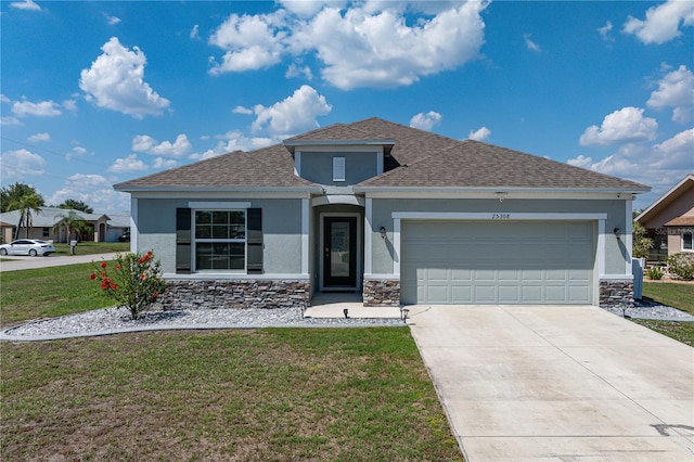 25308 Rupert Rd, Punta Gorda, FL 33983 - ranch-style house with stucco siding, a front lawn, stone siding, and an attached garage