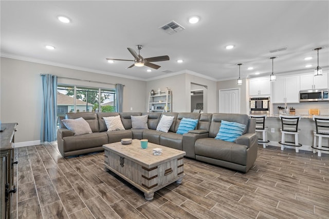 25308 Rupert Rd, Punta Gorda, FL 33983 - living area featuring a ceiling fan, recessed lighting, dark wood-style floors, ornamental molding, and baseboards