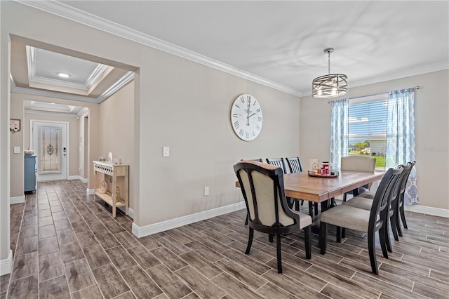 25308 Rupert Rd, Punta Gorda, FL 33983 - dining room featuring crown molding, baseboards, wood finished floors, and a chandelier