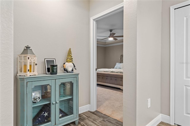 25308 Rupert Rd, Punta Gorda, FL 33983 - corridor with wood finish floors, baseboards, and crown molding