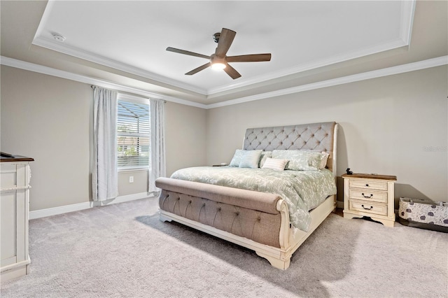 25308 Rupert Rd, Punta Gorda, FL 33983 - bedroom featuring a tray ceiling, crown molding, carpet flooring, baseboards, and a ceiling fan